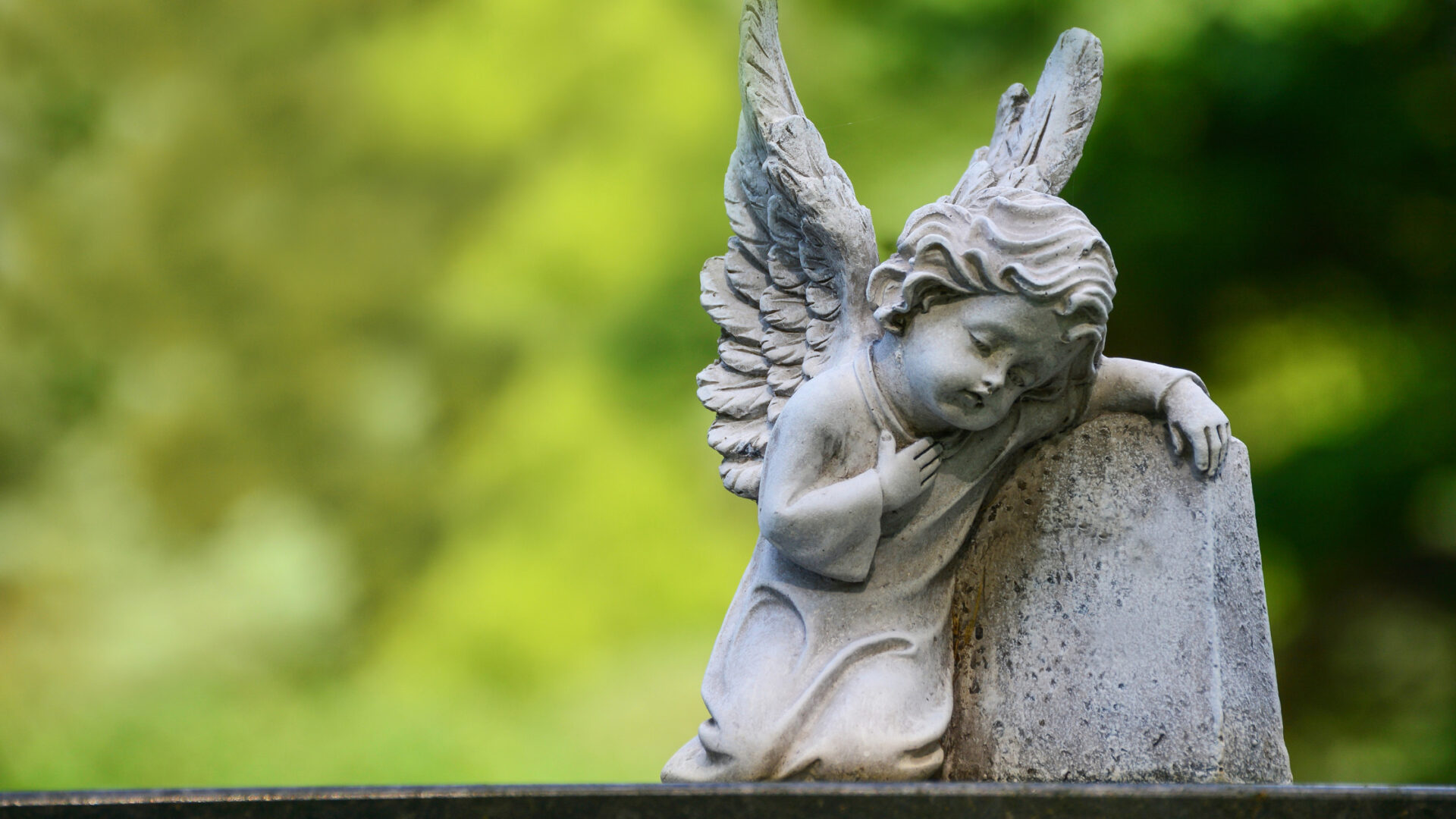 A baby angel statue with wings