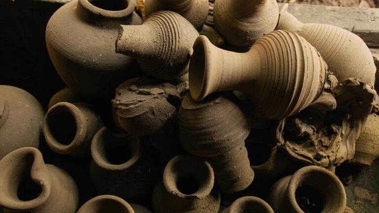 A bunch of clay pots stacked on top of each other.