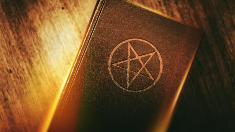 A book with a satanic emblem on it.