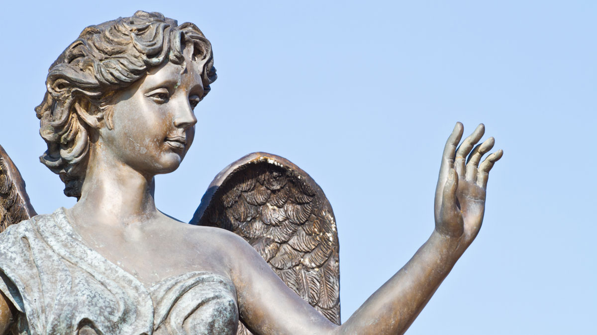 An angel statue waving.