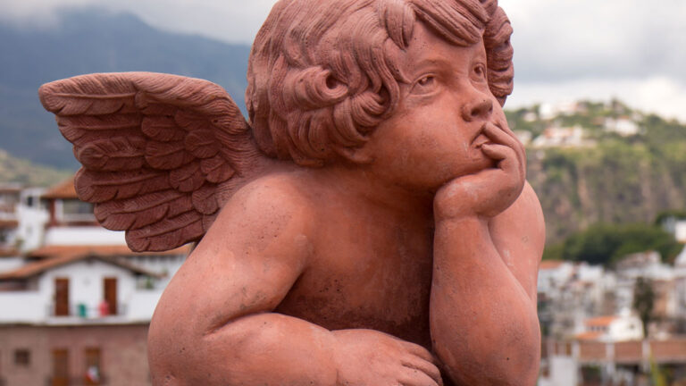 A baby winged angel statue.