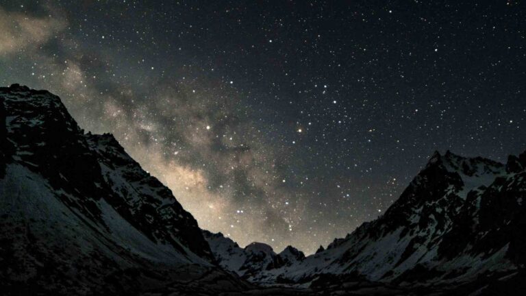 A starry night sky in the alpine mountains.